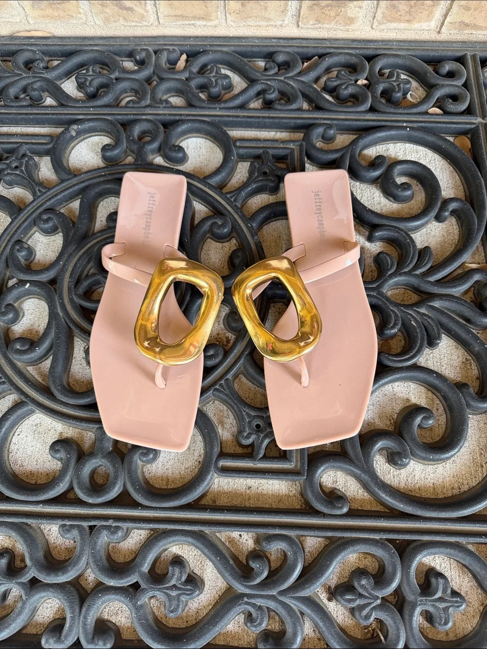 Women’s blush pink thong sandals with gold buckle